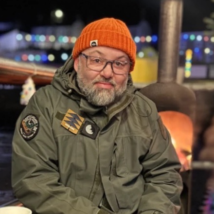 Tim, the owner of Tech Made Simple, wearing glasses and an orange woolly hat